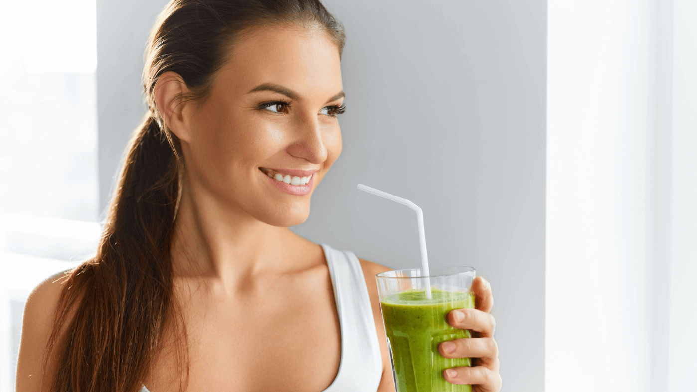 woman drinking smoothie
